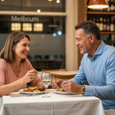 Happy couple enjoying a meal at a vibrant Melbourne restaurant, warm lighting, no text, no words, no typography